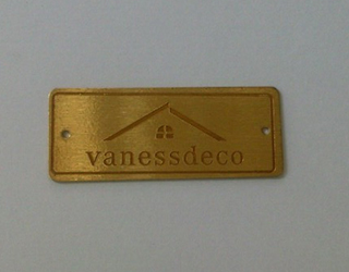 Logo mạc kim loại VANESSDECO